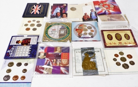 Nine Royal Mint commemorative coin sets, to include 1996, 2002, 1995, 40th Anniversary Coronation crown, Golden Wedding 1997 crown, etc., and an album of banknotes, to include five pound note, ten shilling note, Middle Eastern banknotes, Canadian dollar, 