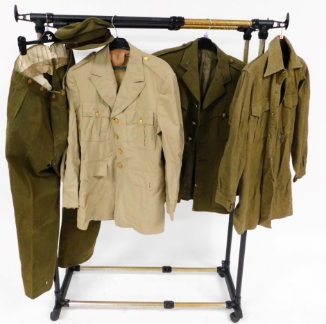 A World War II British Army Royal Corps army Ordinance officer's dress jacket, a pair of trousers, cap, shirt, and a khaki drill jacket. (5)