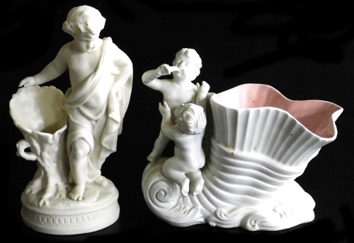 A late 19thC parian spill vase, modelled as a boy wearing a toga, leaning against a tree stump, raised on an oval base, 23cm high, together with an Italian shell form pottery vase, modelled with putti, 21cm high. (2) (AF)