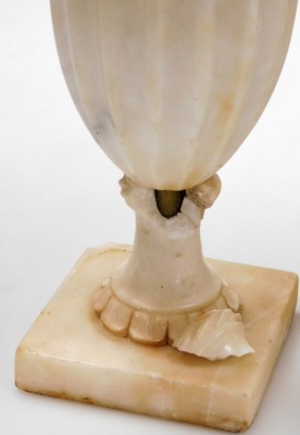 An Italian alabaster table lamp, of twin handled baluster form, carved with leaves and roses, 35cm high, two further alabaster table lamps and an onyx table lamp. (4) - 2