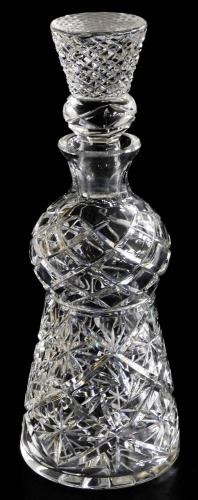 A heavy cut glass decanter and stopper, of thistle form, 34cm high.