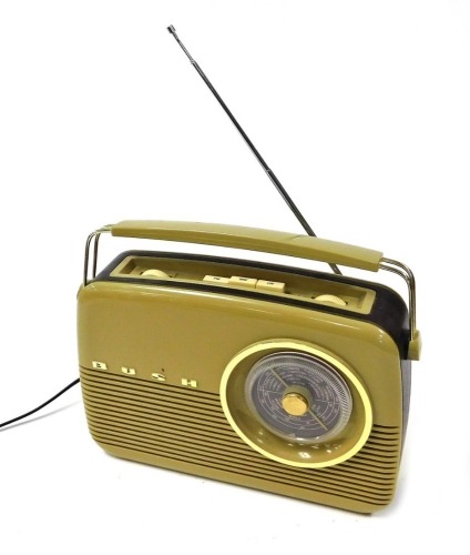 A Bush cream Bakelite electric radio, model 2R82/97.