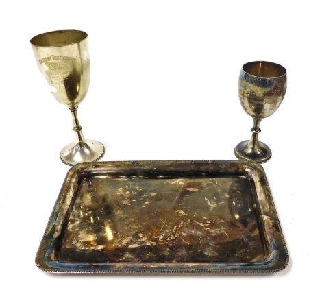 A silver plated tray, engraved to Lieutenant G T Dadson, The Devonshire Regiment, By Members Of The Sergeants Mess 1936, together with a chalice, For The Military Tournament Sheffield May 1888, First Prize, Sergt Chriss F/4 R.A and a further trophy, First