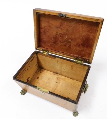 A Georgian burr yew tea caddy, of sarcophagus form, with brass lion's head and ring handles, opening to reveal a vacant interior, raised on brass lion's paw feet, 22cm wide. - 4