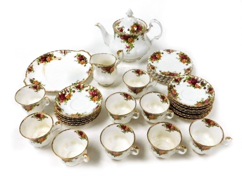 A Royal Albert porcelain part tea service, decorated in the Old Country Roses pattern, comprising teapot, cream jug, bread plate, nine teacups, fourteen saucers and six tea plates.