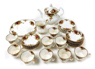 A Royal Albert porcelain part tea service, decorated in the Old Country Roses pattern, comprising teapot, cream jug, bread plate, nine teacups, fourteen saucers and six tea plates.