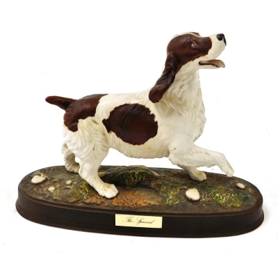 A Royal Doulton matt figure of The Spaniel, raised on a naturalistic oval base, with name plate, printed mark, 30cm wide.