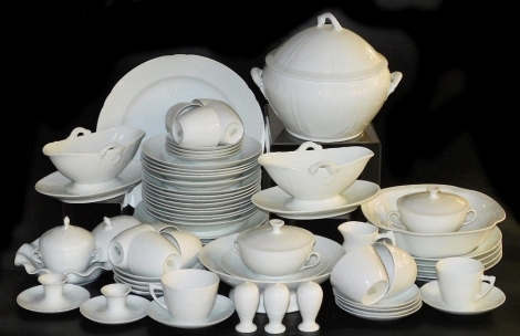 A Bing & Grondahl white glazed porcelain part dinner and coffee service, including a soup tureen and cover, vegetable dish, sauce boat on integral stands, oval meat platter, dinner dessert and soup plates, coffee cups and saucers, condiments, etc. (a quan