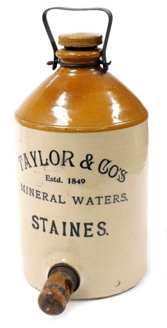 A Taylor and Company Mineral Waters dispenser, two tone stoneware, with metal carrying handle, and wooden tap, 41cm high.