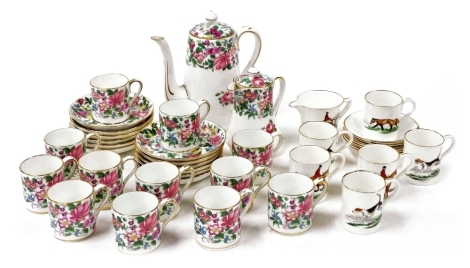 A Crown Staffordshire porcelain coffee service decorated with flowers, comprising coffee pot, covered jug, twelve demi-tasse coffee cans and saucers, together with a Dulcie Vaughan porcelain part coffee service, decorated with hunting figures on horseback