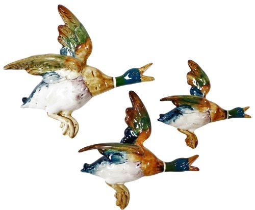 A graduated set of Beswick Mallard wall plaques, numbers 596-2, 3 & 4, printed marks.