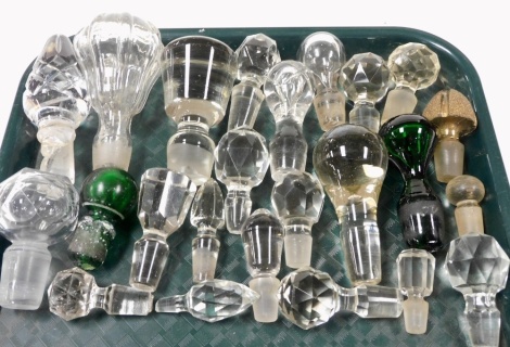 A group of Victorian and later cut glass decanter and perfume bottle stoppers.