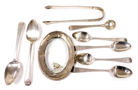 A group of small silver, to include a pair of George III silver teaspoons, London 1809, a set of four George III Old English pattern coffee spoons, London 1787, a pair of Georgian silver sugar tongs with bright cut decoration, a silver oval photograph fra