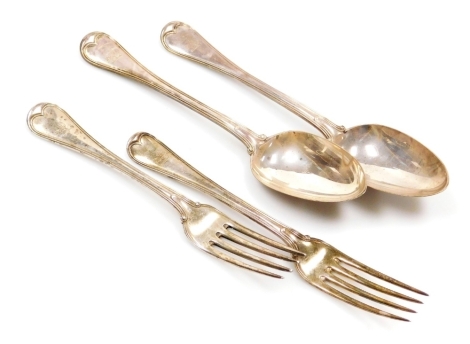 Two sets of Victorian silver Rattail pattern serving fork and spoons, each with an engraved crest, Chawner & Co (George William Adams), London 1847, 1848, and 1854, 12.17oz.