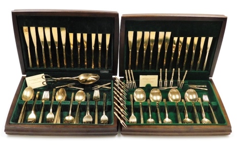 A Thai polished bronze canteen of cutlery, contained in two cases.