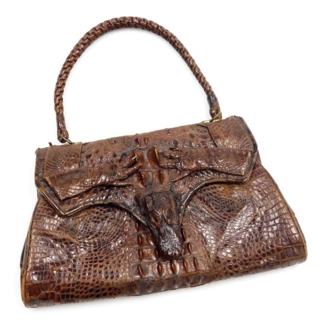 A vintage mid century crocodile skin handbag, 30.5cm wide.