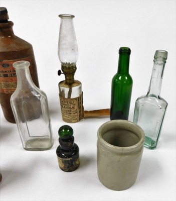 Victorian glass bottles, storage jars including Stephens blue black writing fluid and Tuxford & Tebbutt Limited Stilton cheese, and a Dr Ely Parson's Famous Miracle oil lamp. (a quantity) - 3