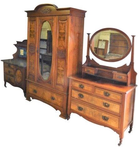 A late 19thC walnut and burr walnut bedroom suite, comprising a marble topped wash stand, the top with a floral carved panel, with a tiled back, the base with three drawers flanked by a single cupboard, 130cm high, 107cm wide, 50cm deep, a wardrobe, flora