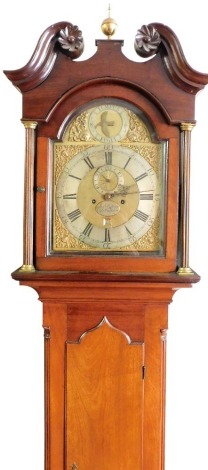 A Georgian mahogany longcase clock, by Andrew Padbery Bishops Waltham, the Tempus Fugit break arch dial with dolphin and mask spandrels, silver chapter ring bearing Roman and Arabic numerals, subsidiary seconds dial and date aperture, eight day movement w