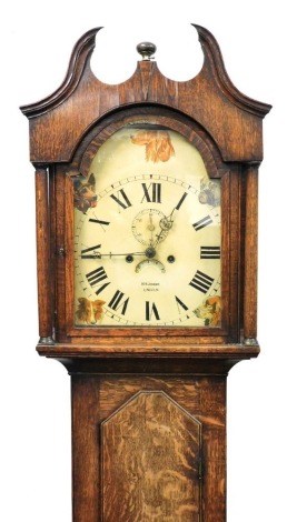 A Georgian and later longcase clock by MS Johnson of Lincoln, the break arch dial painted with dog's heads, dial bearing Roman numerals, subsidiary seconds dial, date aperture, eight day movement with bell strike, the hood with break arch pediment, raised