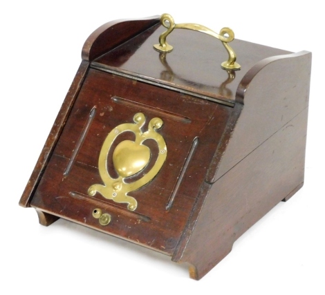 A Victorian mahogany coal scuttle, with brass carrying handle and decorative motif to the lift up front, with wooden liner, no shovel, 33cm wide, 43cm deep.