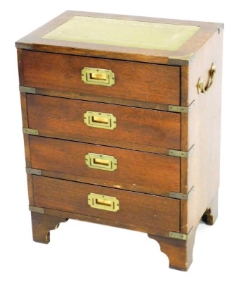 A mahogany campaign style chest, with a tooled green leather top, over four frieze drawers, raised on cabriole legs, 59cm high, 46cm wide, 30.5cm deep.