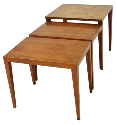 A mid century Danish nest of rosewood and teak occasional tables, bears label to largest table, numbered 008/120, 45cm high, 50cm wide, 42cm deep.