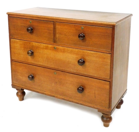 A Victorian oak chest of two short over two long drawers, raised on turned feet, 92cm high, 106cm wide, 46cm deep.