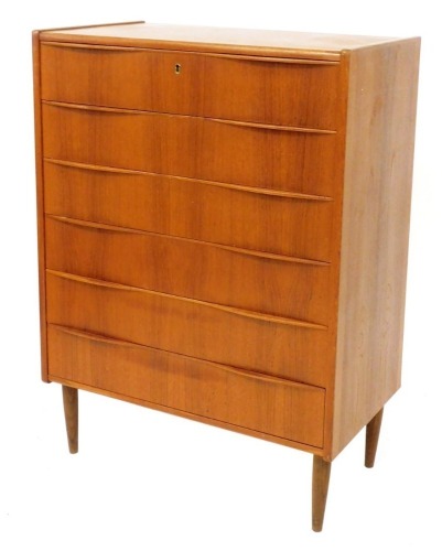 A mid century Danish teak chest of six long drawers, raised on turned legs, 110cm high, 80cm wide, 45cm deep.