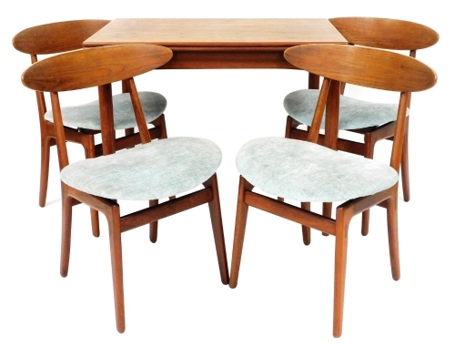 A Danish mid century teak and rosewood dining suite, by Schonning and Elgaard, comprising a draw leaf dining table raised on turned legs, 74cm high, 90cm wide, 60cm deep, together with four single dining chairs. The upholstery in this lot does not comply