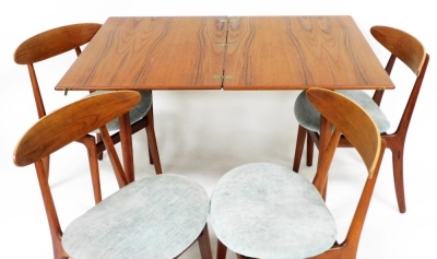 A Danish mid century teak and rosewood dining suite, by Schonning and Elgaard, comprising a draw leaf dining table raised on turned legs, 74cm high, 90cm wide, 60cm deep, together with four single dining chairs. The upholstery in this lot does not comply - 2