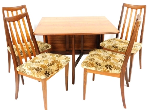 A 1960's G-Plan teak drop leaf dining table, raised on trestle end supports united by a straight stretcher, 73cm high, 30cm wide, 174cm extended, 90cm deep, together with four single dining chairs. The upholstery in this lot does not comply with the 1988