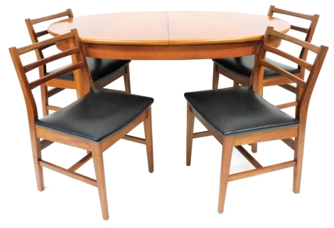 A 1960's teak dining suite, by A and FH Limited, the oval draw leaf dining table raised on turned legs, 74cm high, 146cm wide, 90cm deep, together with four single ladder back dining chairs. The upholstery in this lot does not comply with the 1988 (Fire 