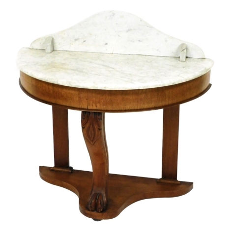 A Victorian demi lune and marble topped washstand, raised on a cabriole leg terminating on a lion's paw foot, and rear straight supports, united on a triform base, 88cm high, 90cm wide, 45cm deep