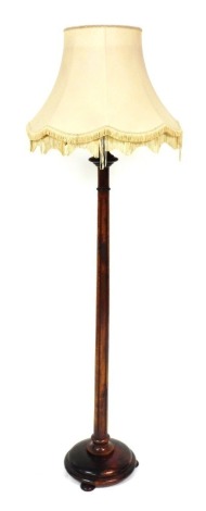 A Victorian stained oak standard lamp, with an oatmeal coloured shade, 187cm high.