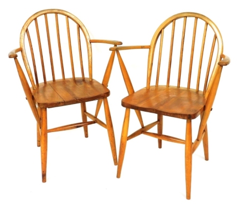 A pair of Ercol utility period light elm and beech Windsor carver chairs, number F182.