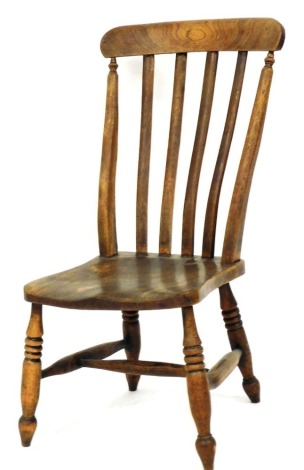 A Victorian beech and elm lath back nursing chair, with a solid saddle seat, raised on ring turned legs, united by a H framed stretcher.