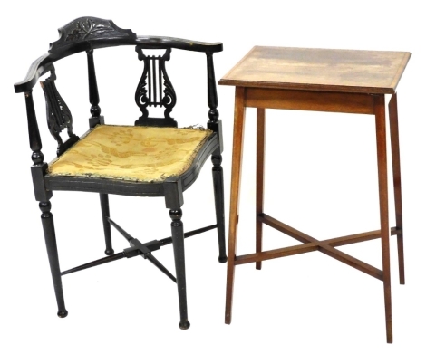 An Edwardian ebonised corner chair, with two pierced splats, a padded seat on turned tapering legs with X shaped stretcher, and a mahogany satinwood cross banded rectangular occasional table, on square tapering legs.