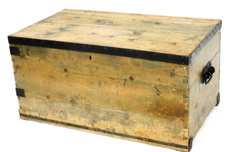 A Victorian pine and iron bound chest, with carrying handles, 47cm high, 92cm wide, 53.5cm deep.