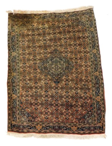 A Persian Farahan rug, the central lozenge surrounded by repeat all over pattern within multiple borders, 150cm x 112cm.