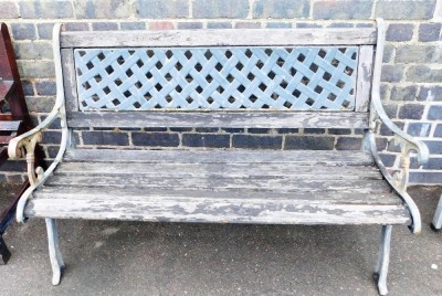 A slatted garden bench, with cast iron ends and pierced back, 125cm wide.