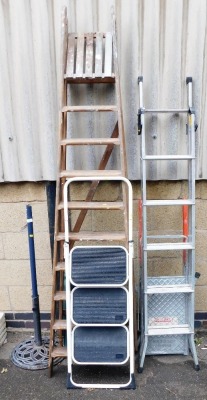 Various step ladders, to include a wooden A frame step ladder, garden parasol stand, etc. (a quantity)