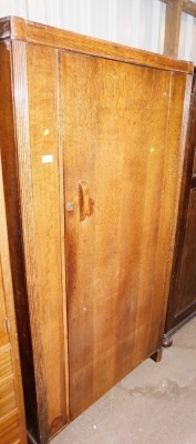 A 1930's oak single wardrobe, 180cm high, 91cm wide, 48cm deep.