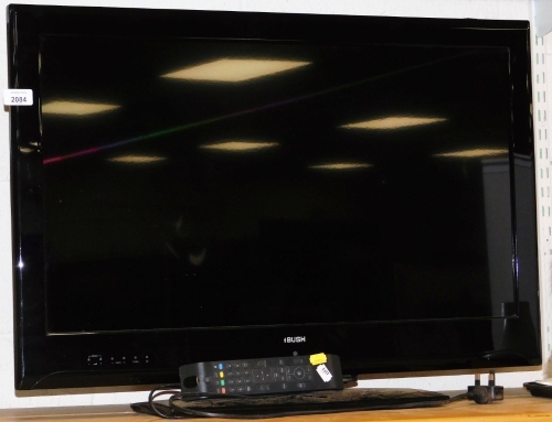 A Bush 32" flat screen television, DLE032947HD, with lead and remote.