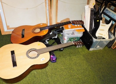 Two acoustic guitars, comprising Gear4music CG-4/4NT and Horner, and an electric guitar construction kit, with accessories.