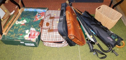 Various walking sticks, umbrellas, a chestnut leather briefcase, wicker basket, table linen, etc. (contents under one table)