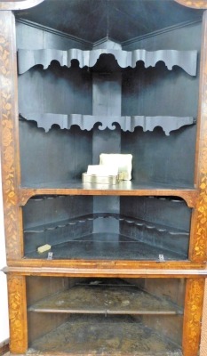 A 18thC Dutch marquetry corner cabinet, with fixed swan neck pediment, raised above heavily carved shelves and cupboard beneath, profusely decorated with leaves and flowers with a lower geometric inlay, fronted by two elaborate designed doors, 243cm high, - 5