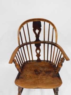 A early 19thC ash and elm Windsor low back armchair, with pierced vase splat and turned legs with H frame stretcher, the seat stamped GRANTHAM. - 2