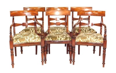 A set of six William IV mahogany dining chairs, including two carvers, having overrun cresting rails, fan and block bar backs, drop in seats and turned forelegs.