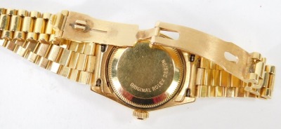 A Rolex 18ct gold cased lady's Oyster Perpetual Datejust wristwatch, Superlative Chronometer Official Certified, circular white dial bearing Roman numerals, centre seconds, date aperture, model 69178, serial number L359362, circa 1988, on an 18ct gold bra - 2